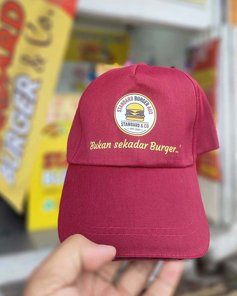Standard Burger AU3 cap with the tagline Bukan sekadar Burger